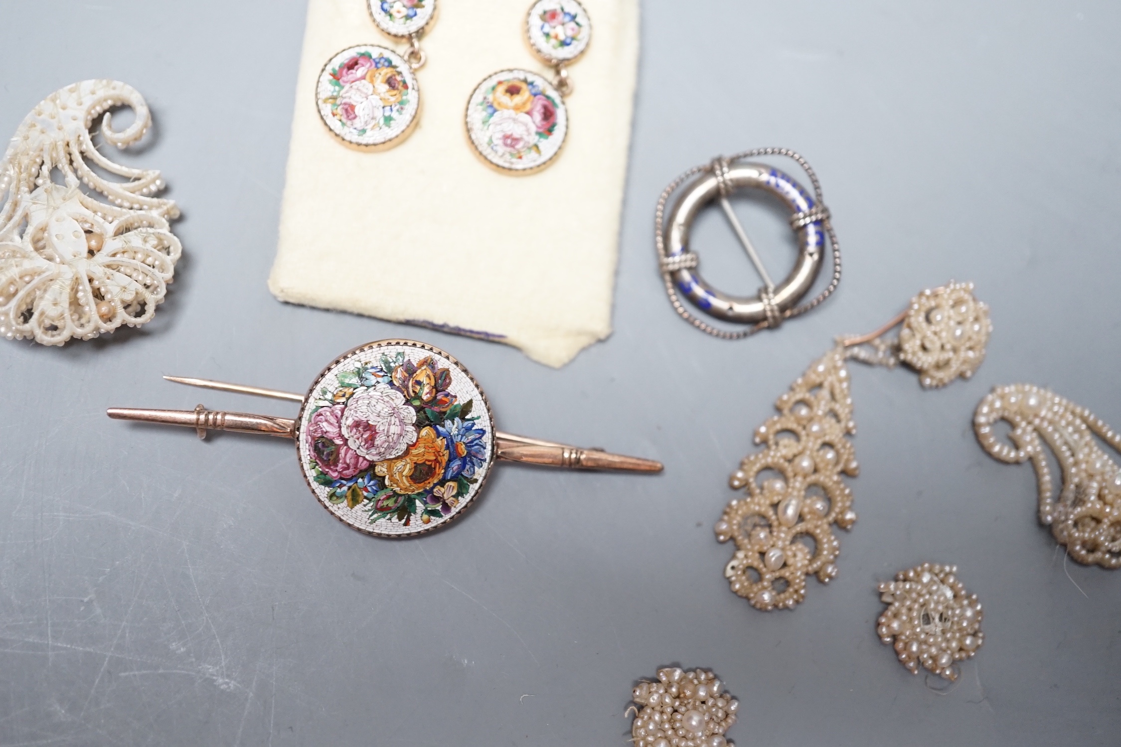 A suite of yellow metal and micro mosaic jewellery comprising a brooch, 72mm and pair of earrings, five items of seed pearl jewellery and a brooch.